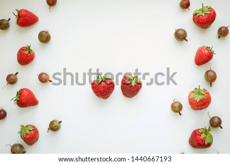 Red strawberry berries on a white background, top view