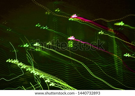 Abstract city lights long exposure background with green wavy lines