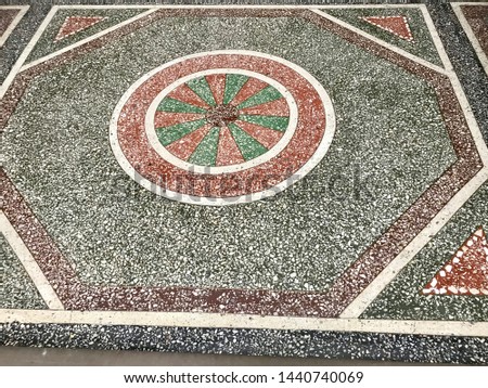 old place mosaic with  a wonderful round shaped flower in the middle