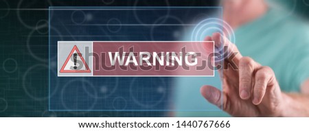 Man touching a warning concept on a touch screen with his finger