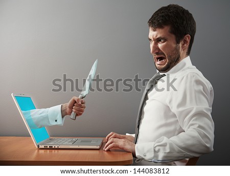 startled man looking at hand with knife Royalty-Free Stock Photo #144083812
