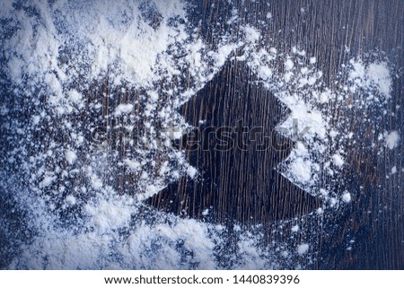 New Year 2020 background. Christmas tree on a wooden rustic table. Silhouette of flour. Happy new year concept.