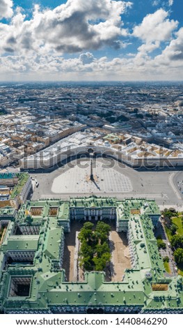Aerial vertical panorama of Saint Petersburg, Russia, Hermitage museum, Winter Palace, Palace Square, embankment, boats on the Neva river, green roofs, Alexander column, Arch of General Staff