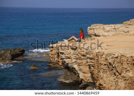 Girl back sea view Cyprus