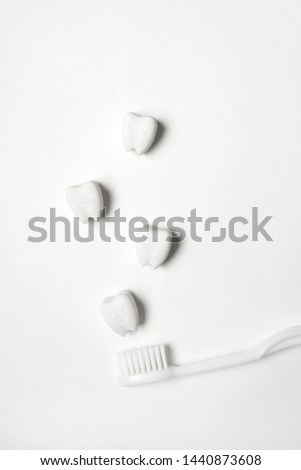 Isolated Happy and Smile Tooth Model with White Toothbrush.