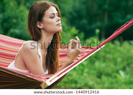 green grass young woman sunbed nature tourism
