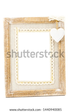 A wooden vintage photo frame has a white background