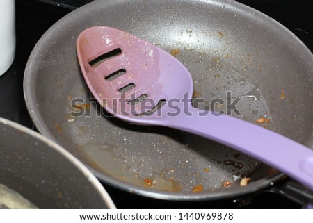 Dirty Purple Skillet on Stove Top