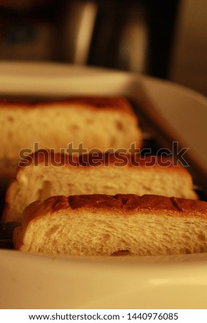 White Bread Toast in a White Toaster