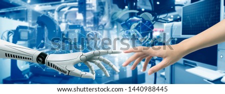 Technology industrial revolution hand robot Imitate learning by hand human on background robot industrial.