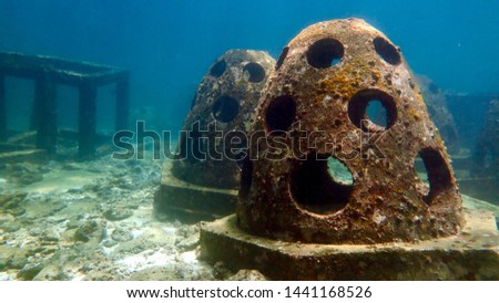 Wreck objects undersea blue water around