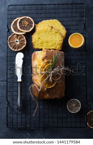 Homemade orange fruit loaf cake with citrus candied fruits and nuts. Traditional treat for tea for Breakfast. Pound cake. Selective focus