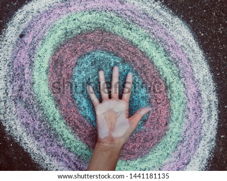 There is a circle on asphalt the on circle a hand Royalty-Free Stock Photo #1441181135