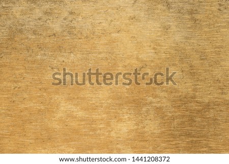 Brushed gold  metal texture. Polished metal texture background with light reflection.