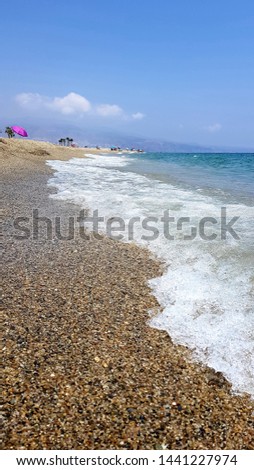 Spectacular shore of the Mediterranean Sea. Waves, sand and foam. Almeria, Andalusia (Spain)