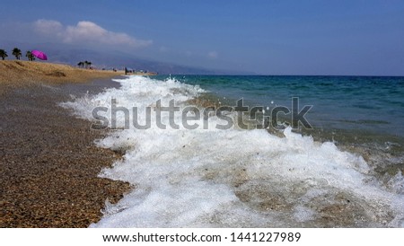 Spectacular shore of the Mediterranean Sea. Waves, sand and foam. Almeria, Andalusia (Spain)