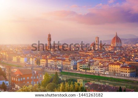 View of the beautiful medieval italian city and culture capital - Florence with cathedrals and bridges over river and cloudy sky at sunset. Travel outdoor sightseeing historical background.