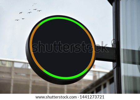 Empty circle and hollow square shop signboard layout. Lightbox attached to the wall on the street. Model. 3d render of mockup color signboard and blank cafe signboard