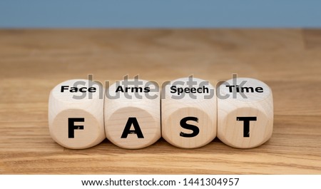 The acronym "FAST" is used as mnemonic to help a person having a stroke. "FAST" stands for "facial drooping", "arm weakness", "speech difficulties" and "time to call emergency services". Royalty-Free Stock Photo #1441304957