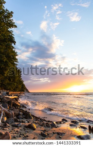 bright soft colors of summer sunset near the sea