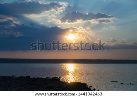 Beautiful twilight silhouette sunset on the Kuyalnik estuary near Odessa. Sunset over the lake. Evening sky with colorful cloud on twilight, Dusk