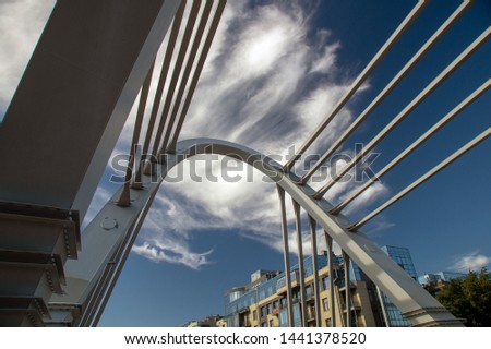 cable bridge in the cityscape on a sunny summer day