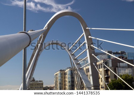 cable bridge in the cityscape on a sunny summer day