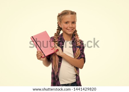 Keeping her secrets in diary. Child cute girl hold notepad or diary isolated on white background. Childhood memories. Diary for girls concept. Note secrets down in your cute girly diary journal.