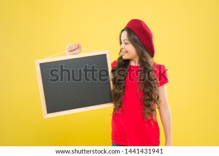 happy school girl in parisian beret. little girl kid with backboard, copy space. board for announcement advertisement. back to school. school shopping sales. kid fashion. Best Service.