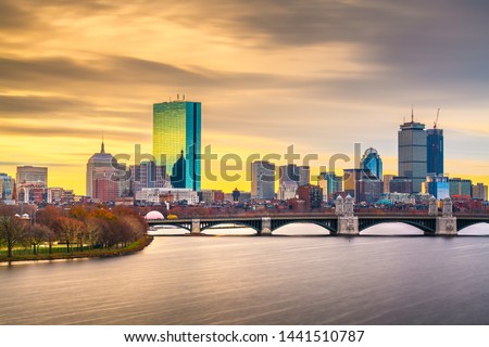 Boston, Massachusetts, USA downtown cityscape from across the Charles River at dawn. 