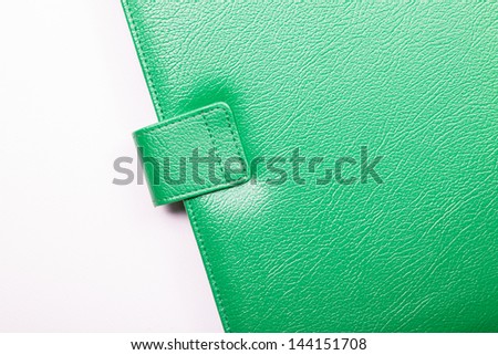 Close up of green leather cover of notebook