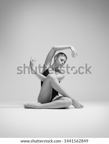Beautifull flexible blonde girl posing. Gymnastics. 