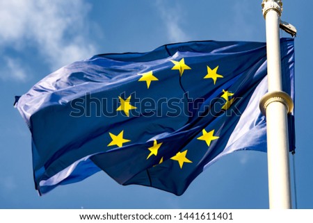 EU flag against a blue sky.