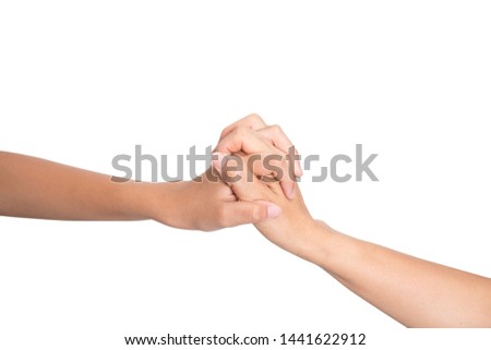 Teenage girl hand clasping hands with old woman's hand isolated on white