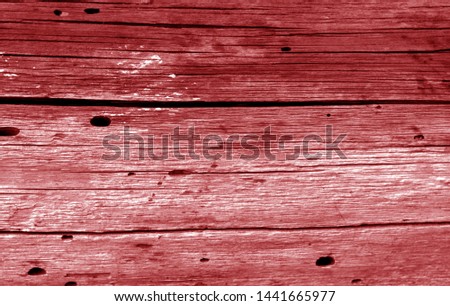 Old grunge wooden fence pattern in red tone. Abstract background and texture for design.