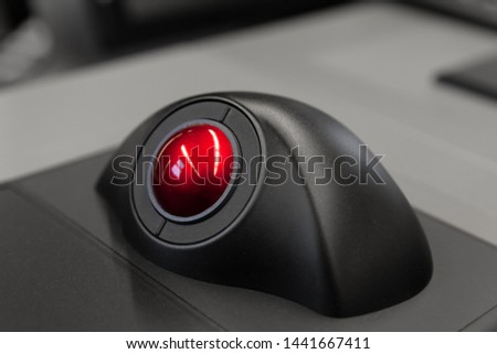 Industrial control panel with red trackball, close up photo with soft selective focus Royalty-Free Stock Photo #1441667411