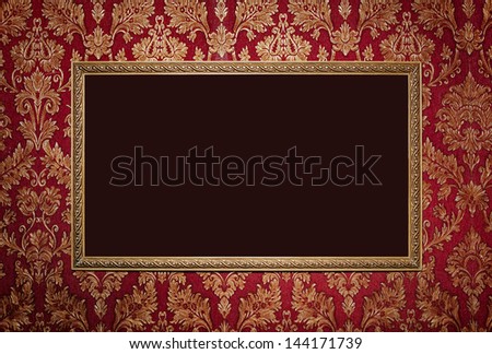 Red retro interior with empty exposition in gold frame and wall