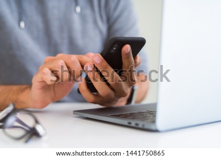 Close up of man using smartphone