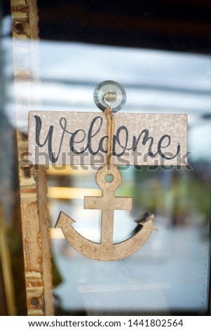 Welcome sign with anchor decoration