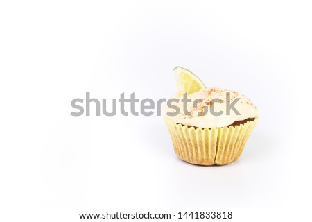 Sweet dessert, cupcake with butter cream isolated on white background.