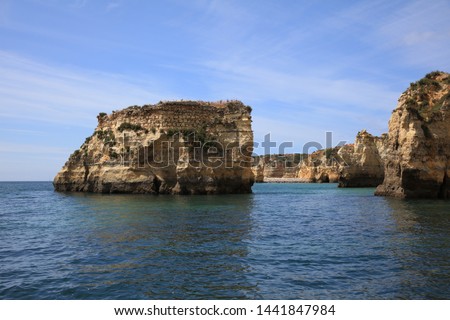 Ponta da Piedade with eroded rock formations and natural arches. Lagos. Portugal