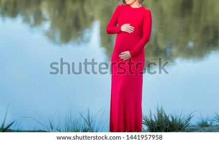 women waiting for baby resting on the lake