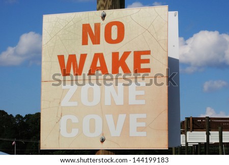No wake zone cove sign.