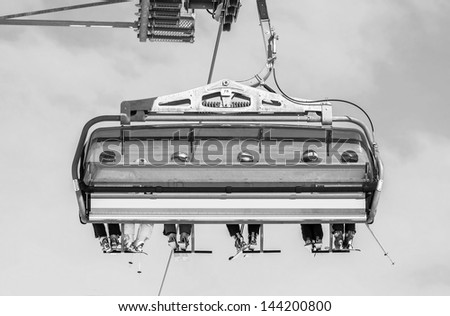 One of chair lifts in a ski resort of a valley of Zillertal - Mayrhofen region, Austria (black and white)