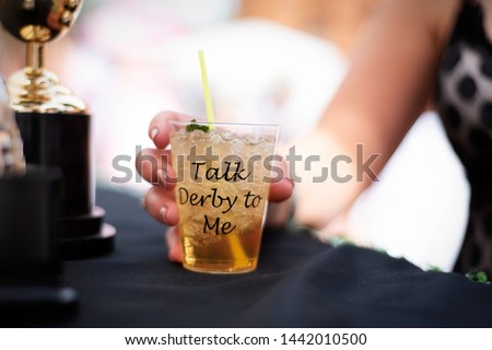 Talk Derby to Me classic mint julep cocktail at derby party Royalty-Free Stock Photo #1442010500