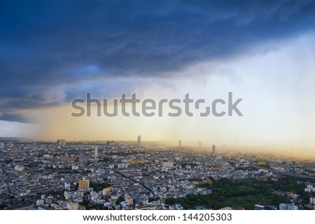 View of a raining over cityscape