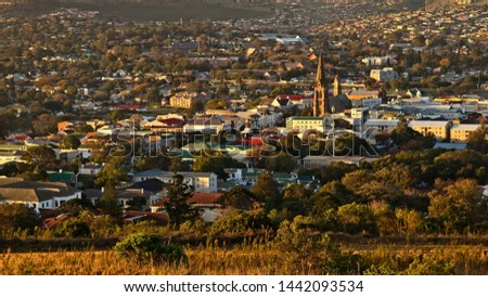 A landscape image of the town of Makhanda (Grahamstown), South Africa during sunset. 
