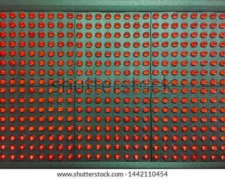 LED module on a white background. Red pixels on the LED module. Components for light advertising. Close-up.