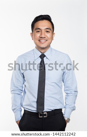 Asian man wearing business attire smiling  Royalty-Free Stock Photo #1442112242