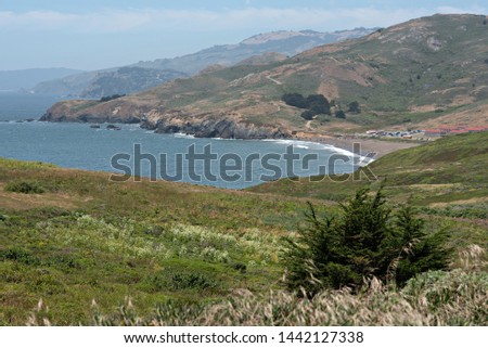 Rolling Hills of the Marin Headlands Down to the Pacific Ocean Royalty-Free Stock Photo #1442127338
